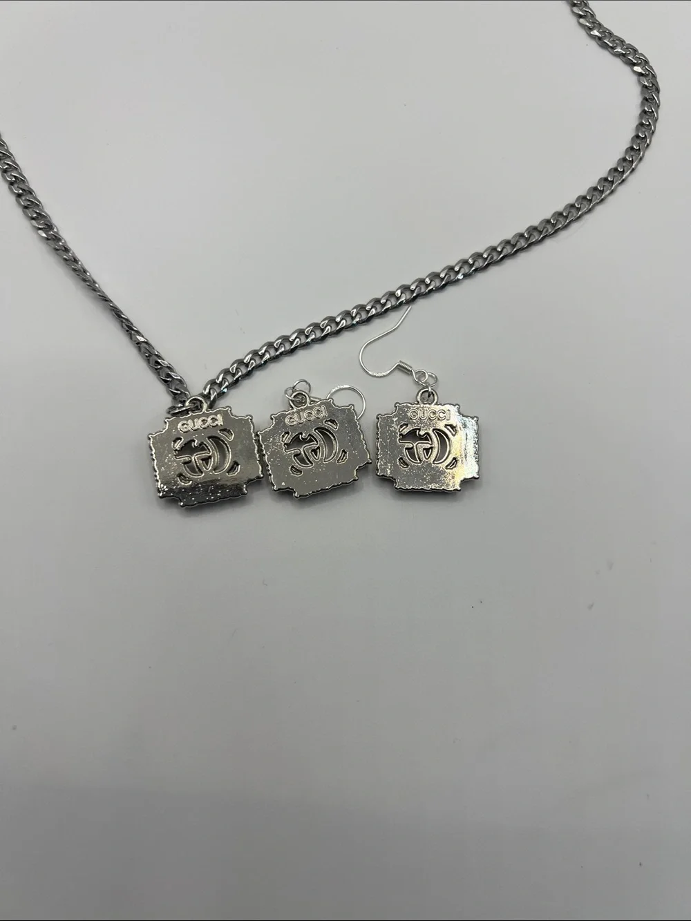 1469. Silver Tone Necklace & Earrings Set 18” with AB crystal stamped charms